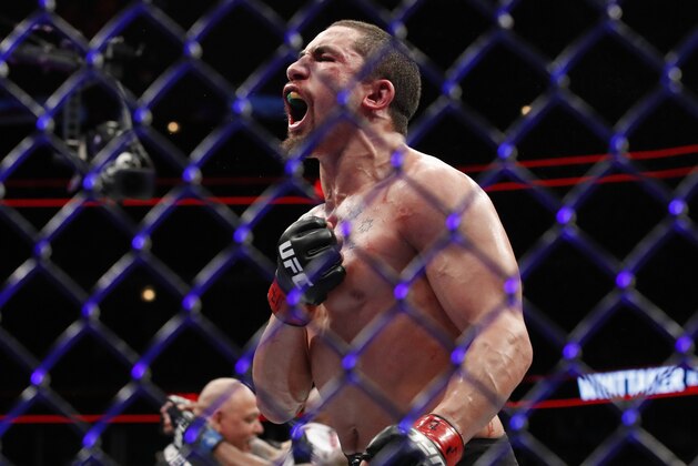 FILE - In this June 10, 2018, file photo, Robert Whittaker reacts after his middleweight mixed martial arts title bout against Yoel Romero at UFC 225 in Chicago. Whittaker defends his UFC middleweight title against Kelvin Gastelum in the main event of UFC 234 in Melbourne, Australia, on Sunday. (AP Photo/Jim Young, File)