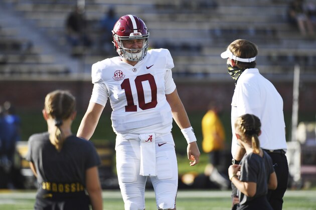 Alabama quarterback Mac Jones, center, talks with Missouri head coach Eliah Drinkwitz, right, and Drinkwitz's daughters before an NCAA college football game Saturday, Sept. 26, 2020, in Columbia, Mo. (AP Photo/L.G. Patterson)