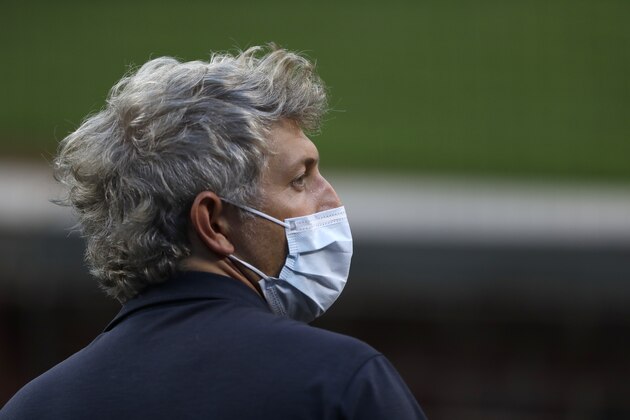 Baltimore Orioles general manager Mike Elias wears a face mask during baseball training camp camp, Tuesday, July 14, 2020, in Baltimore. (AP Photo/Julio Cortez)