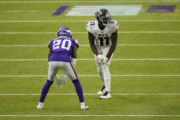 Atlanta Falcons wide receiver Julio Jones (11) lines up against Minnesota Vikings cornerback Jeff Gladney (20) during the second half of an NFL football game, Sunday, Oct. 18, 2020, in Minneapolis. (AP Photo/Jim Mone)