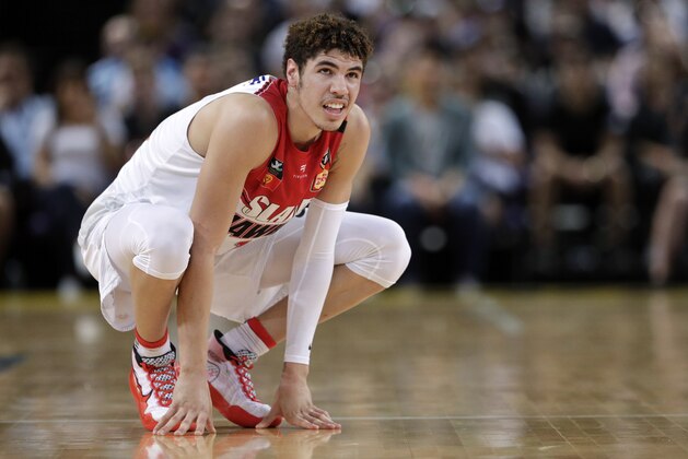 FILE-  In this Nov. 17, 2019, file photo, LaMelo Ball of the Illawarra Hawks squats during their game against the Sydney Kings in the Australian Basketball League in Sydney. The point guard from California who bypassed college and played overseas is expected to be one of the top picks when the twice-delayed NBA draft is held in November.  (AP Photo/Rick Rycroft, File)