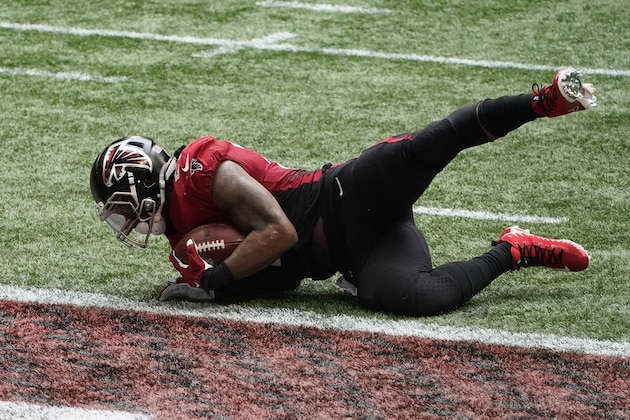 Atlanta Falcons running back Todd Gurley (21) scores a touchdown against the Detroit Lions during the second half of an NFL football game, Sunday, Oct. 25, 2020, in Atlanta. (AP Photo/John Bazemore)