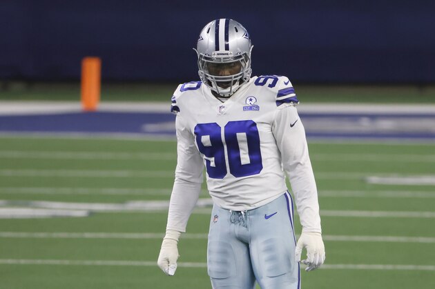 Dallas Cowboys defensive end DeMarcus Lawrence (90) waits between plays as the Cowboys play the Arizona Cardinals during an NFL football game in Arlington, Texas, Sunday, Oct. 19, 2020. (AP Photo/Ron Jenkins)