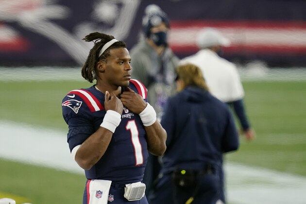 New England Patriots quarterback Cam Newton watches from the sideline after being replaced by Jarrett Stidham in the second half of an NFL football game against the San Francisco 49ers, Sunday, Oct. 25, 2020, in Foxborough, Mass. (AP Photo/Charles Krupa)