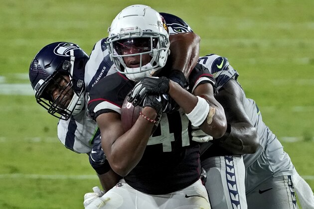 Arizona Cardinals running back Kenyan Drake (41) is tackled by Seattle Seahawks outside linebacker K.J. Wright during the second half of an NFL football game, Sunday, Oct. 25, 2020, in Glendale, Ariz. (AP Photo/Rick Scuteri)