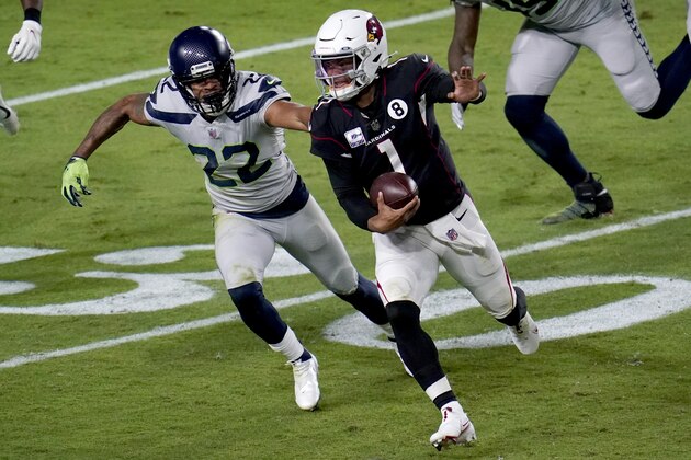 Arizona Cardinals quarterback Kyler Murray (1) eludes the reach of Seattle Seahawks cornerback Quinton Dunbar (22) during the first half of an NFL football game, Sunday, Oct. 25, 2020, in Glendale, Ariz. (AP Photo/Ross D. Franklin) Arizona Cardinals quarterback Kyler Murray (1) eludes the reach of Seattle Seahawks cornerback Quinton Dunbar (22) during the first half of an NFL football game, Sunday, Oct. 25, 2020, in Glendale, Ariz. (AP Photo/Ross D. Franklin)