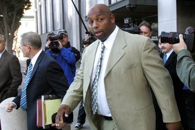 FILE - In this Jan. 18, 2008, file photo, former NFL football player Dana Stubblefield leaves a federal courthouse in San Francisco. Stubblefield was sentenced to 15 years to life in prison, Thursday, Oct. 22, 2020, for raping a prospective babysitter at his Morgan Hill home five years earlier. (AP Photo/Jeff Chiu, File)