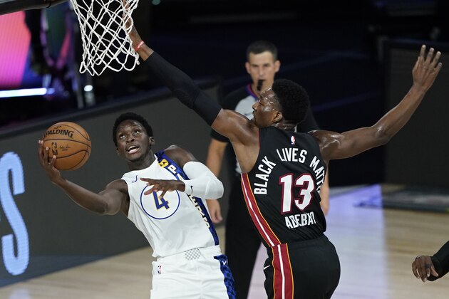 Indiana Pacers' Victor Oladipo (4) shoots around Miami Heat's Bam Adebayo (13) during the first half of an NBA basketball first round playoff game Monday, Aug. 24, 2020, in Lake Buena Vista, Fla. (AP Photo/Ashley Landis, Pool) Indiana Pacers' Victor Oladipo (4) shoots around Miami Heat's Bam Adebayo (13) during the first half of an NBA basketball first round playoff game Monday, Aug. 24, 2020, in Lake Buena Vista, Fla. (AP Photo/Ashley Landis, Pool)