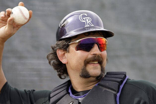 Colorado Rockies catcher Sal Fasano throws during spring training baseball on Monday, Feb. 23, 2009  in Tucson, Ariz. (AP Photo/Elaine Thompson)