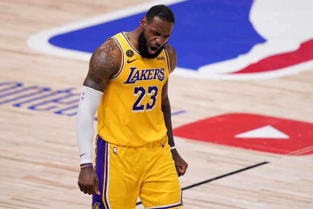 Los Angeles Lakers forward LeBron James celebrates during the second half in Game 4 of basketball's NBA Finals against the Miami Heat Tuesday, Oct. 6, 2020, in Lake Buena Vista, Fla. (AP Photo/Mark J. Terrill)