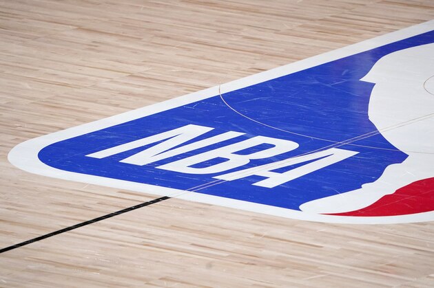 The NBA logo at center court is shown during the second half of an NBA first-round playoff basketball game between the Houston Rockets and Oklahoma City Thunder in Lake Buena Vista, Fla., Wednesday, Sept. 2, 2020. (AP Photo/Mark J. Terrill)