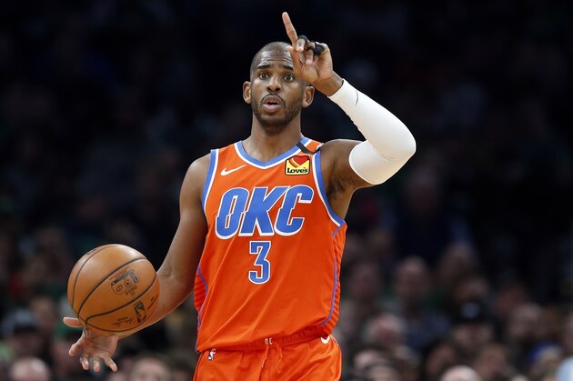 In this March 8, 2020, photo, Oklahoma City Thunder's Chris Paul plays against the Boston Celtics during an NBA basketball game in Boston. Making it safe for America's professional sports teams to start playing games is one thing. Making sure athletes are in game shape is another. Experts say nothing should be rushed. Athletes in the NBA, NHL and Major League Baseball all indicate that a few weeks of training is necessary before any games. (AP Photo/Michael Dwyer)
