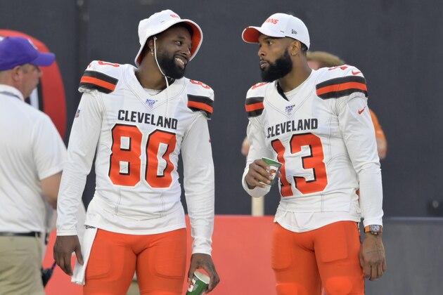FILE - In this Aug. 8, 2019, file photo, Cleveland Browns wide receivers Jarvis Landry (80) and Odell Beckham Jr. (13) talk on the sideline during an NFL preseason football game against the Washington Redskins in Cleveland. The expansion era has been tortuous, two embarrassing decades of despair and dysfunction. Well, those painful days appear to be ending. (AP Photo/David Richard, File) FILE - In this Aug. 8, 2019, file photo, Cleveland Browns wide receivers Jarvis Landry (80) and Odell Beckham Jr. (13) talk on the sideline during an NFL preseason football game against the Washington Redskins in Cleveland. The expansion era has been tortuous, two embarrassing decades of despair and dysfunction. Well, those painful days appear to be ending. (AP Photo/David Richard, File)