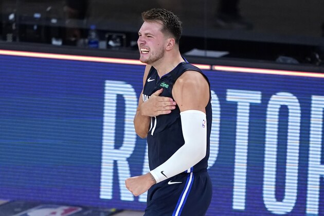 Dallas Mavericks' Luka Doncic celebrates after making a game-winning 3-point basket against the Los Angeles Clippers during overtime of an NBA basketball first round playoff game Sunday, Aug. 23, 2020, in Lake Buena Vista, Fla. The Mavericks won 135-133 in overtime. (AP Photo/Ashley Landis, Pool)