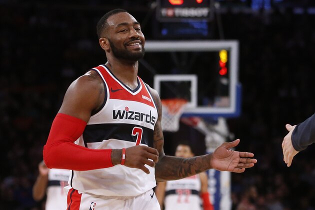 Washington Wizards' John Wall celebrates during the fourth quarter of an NBA basketball game against the New York Knicks Monday, Dec. 3, 2018, in New York. (AP Photo/Jason DeCrow)