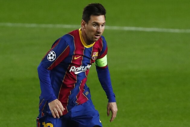 Barcelona's Lionel Messi controls the ball during the Champions League group G soccer match between FC Barcelona and Ferencvaros at the Camp Nou stadium in Barcelona, Spain, Tuesday, Oct. 20, 2020. (AP Photo/Joan Monfort) Barcelona's Lionel Messi controls the ball during the Champions League group G soccer match between FC Barcelona and Ferencvaros at the Camp Nou stadium in Barcelona, Spain, Tuesday, Oct. 20, 2020. (AP Photo/Joan Monfort)