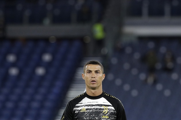 Juventus' Cristiano Ronaldo warms up ahead of the Italian Serie A soccer match between Roma and Juventus at Rome's Olympic stadium, Sunday, Sept. 27, 2020. (AP Photo/Gregorio Borgia)
