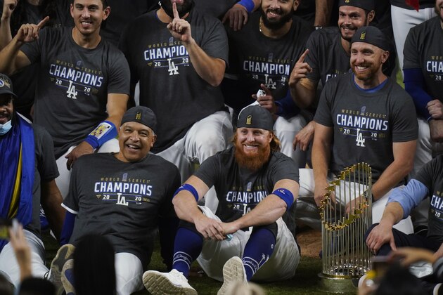 Los Angeles Dodgers manager Dave Roberts and third baseman Justin Turner pose for a group picture after the Dodgers defeated the Tampa Bay Rays 3-1 in Game 6 to win the baseball World Series, Tuesday, Oct. 27, 2020, in Arlington, Texas. (AP Photo/Eric Gay) Los Angeles Dodgers manager Dave Roberts and third baseman Justin Turner pose for a group picture after the Dodgers defeated the Tampa Bay Rays 3-1 in Game 6 to win the baseball World Series, Tuesday, Oct. 27, 2020, in Arlington, Texas. (AP Photo/Eric Gay)