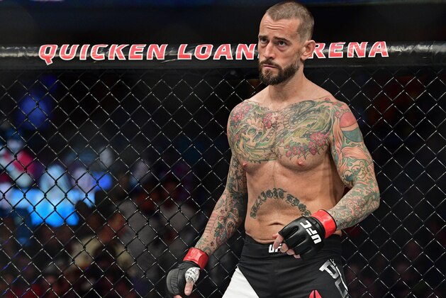 CM Punk stands in his corner before a welterweight bout at UFC 203 on Saturday, Sept. 10, 2016, in Cleveland. Mickey Gall won via submission. (AP Photo/David Dermer)