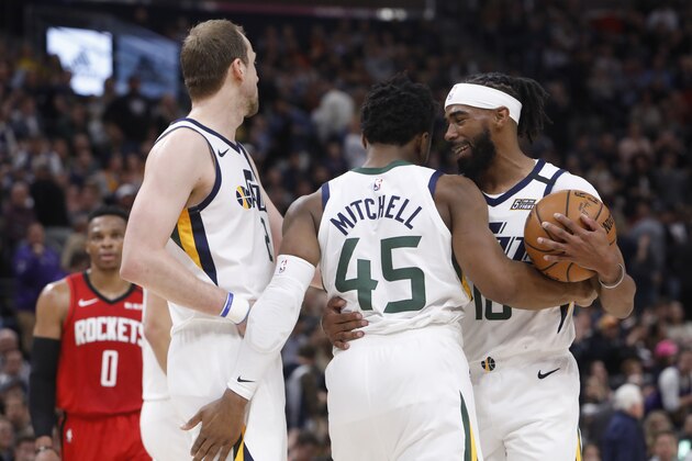 Utah Jazz's Joe Ingles, left, Donovan Mitchell (45) and Mike Conley, right, celebrate taking the lead late in the first half of the team's NBA basketball game against the Houston Rockets on Saturday, Feb. 22, 2020, in Salt Lake City. (AP Photo/Kim Raff)
