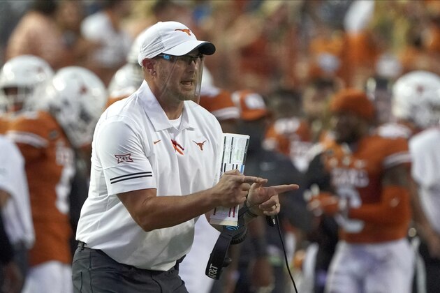 FILE - In this Sept. 12, 2020, file photo, Texas head coach Tom Herman shouts to his team during the first half of an NCAA college football game against UTEP in Austin, Texas. Texas’ Herman and Baylor’s Dave Aranda are old friends and college teammates who will meet for the first time Saturday, Oct. 24, 2020, as opposing head coaches. (AP Photo/Chuck Burton, File)