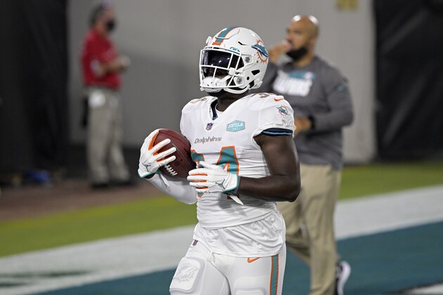 Miami Dolphins running back Jordan Howard (34) warms up before an NFL football game against the Jacksonville Jaguars, Thursday, Sept. 24, 2020, in Jacksonville, Fla. (AP Photo/Phelan M. Ebenhack) Miami Dolphins running back Jordan Howard (34) warms up before an NFL football game against the Jacksonville Jaguars, Thursday, Sept. 24, 2020, in Jacksonville, Fla. (AP Photo/Phelan M. Ebenhack)