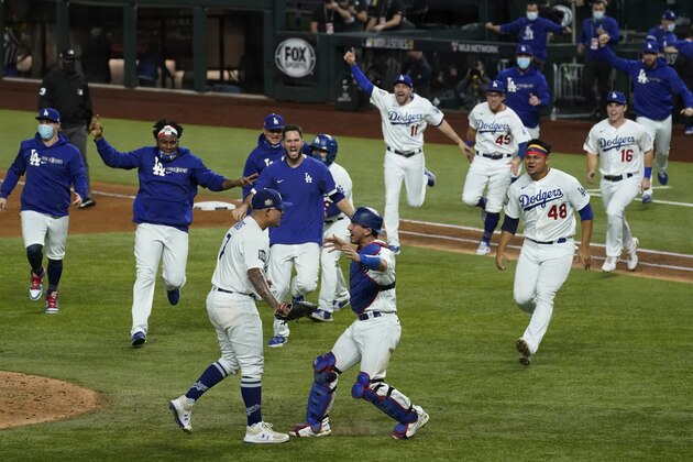 Los Angeles Dodgers celebrate after defeating the Tampa Bay Rays 3-1 to win the baseball World Series in Game 6 Tuesday, Oct. 27, 2020, in Arlington, Texas. (AP Photo/Tony Gutierrez) Los Angeles Dodgers celebrate after defeating the Tampa Bay Rays 3-1 to win the baseball World Series in Game 6 Tuesday, Oct. 27, 2020, in Arlington, Texas. (AP Photo/Tony Gutierrez)