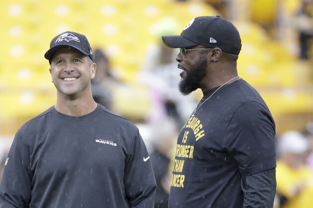 Pittsburgh Steelers head coach Mike Tomlin, right, and Baltimore Ravens head coach John Harbaugh talk before an NFL football game against the Baltimore Ravens, Sunday, Oct. 6, 2019, in Pittsburgh. (AP Photo/Don Wright)