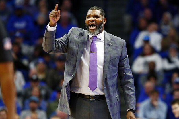 Evansville coach Walter McCarty shouts during the second half of the team's NCAA college basketball game against Kentucky in Lexington, Ky., Tuesday, Nov. 12, 2019. Evansville won 67-64. (AP Photo/James Crisp)