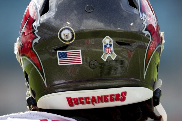 Tampa Bay Buccaneers running back Ronald Jones wears a helmet with a Salute to Service logo on it as he warms up before the start of an NFL football game against the Jacksonville Jaguars, Sunday, Dec. 1, 2019, in Jacksonville, Fla. (AP Photo/Stephen B. Morton) Tampa Bay Buccaneers running back Ronald Jones wears a helmet with a Salute to Service logo on it as he warms up before the start of an NFL football game against the Jacksonville Jaguars, Sunday, Dec. 1, 2019, in Jacksonville, Fla. (AP Photo/Stephen B. Morton)