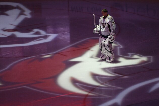 Nashville Predators' Pekka Rinne (35), of Finland, stands in the projection of the Phoenix Coyotes logo prior to the start  of an NHL hockey game Wednesday, April 7, 2010, in Glendale, Ariz.  The Coyotes defeated the Predators 5-2. (AP Photo/Ross D. Franklin)
