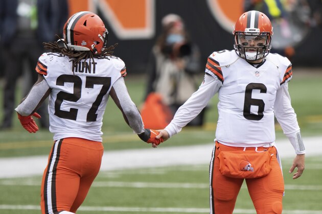 Cleveland Browns quarterback Baker Mayfield (6) high fives running back Kareem Hunt (27) during an NFL football game against the Cincinnati Bengals, Sunday, Oct. 25, 2020, in Cincinnati. (AP Photo/Emilee Chinn)
