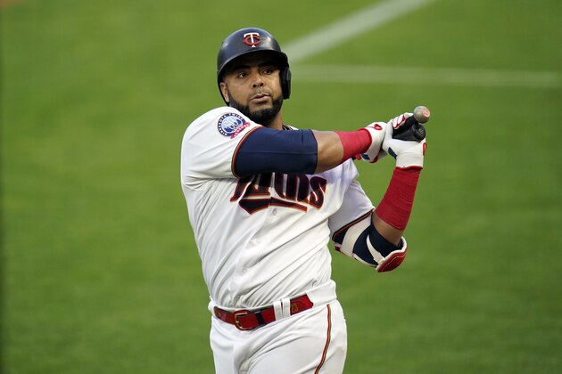 Minnesota Twins designated hitter Nelson Cruz (23)} waits to bat against the Chicago White Sox in a baseball game Monday, Aug. 31 2020, in Minneapolis. (AP Photo/Jim Mone)