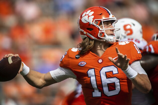 Clemson quarterback Trevor Lawrence (16) makes a pass during an NCAA college football game against Syracuse in Clemson, S.C., on Saturday, Oct. 24, 2020. (Ken Ruinard/Pool Photo via AP) Clemson quarterback Trevor Lawrence (16) makes a pass during an NCAA college football game against Syracuse in Clemson, S.C., on Saturday, Oct. 24, 2020. (Ken Ruinard/Pool Photo via AP)