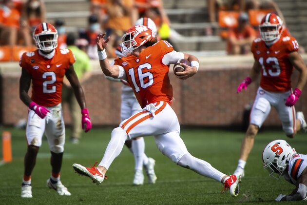 Clemson quarterback Trevor Lawrence (16) runs the ball during their game against Syracuse at Memorial Stadium in Clemson, S.C. on Oct. 24, 2020. (Ken Ruinard/Pool Photo via AP)