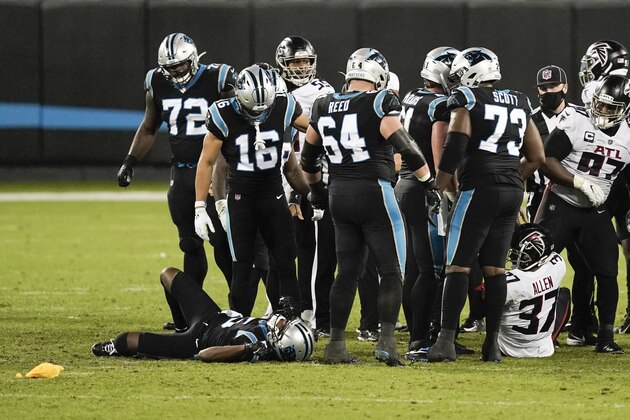 Carolina Panthers quarterback Teddy Bridgewater lays injured on the field during the second of an NFL football game against the Atlanta Falcons Thursday, Oct. 29, 2020, in Charlotte, N.C. (AP Photo/Gerry Broome)