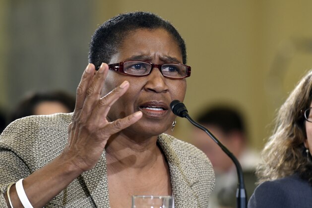 FILE - In this Dec. 2, 2014, file photo, Michele Roberts, executive director of the National Basketball Players Association, testifies on Capitol Hill in Washington. Roberts planned on being in the NBAâ€™s restart bubble at Walt Disney World for a few days. Three weeks, at the most. She never left. (AP Photo/Susan Walsh, File)