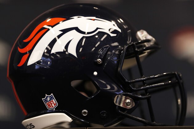 Team helmet sits on desk as Denver Broncos new head coach Vic Fangio speaks during a news conference at the team's headquarters Thursday, Jan. 10, 2019, in Englewood, Colo. (AP Photo/David Zalubowski)