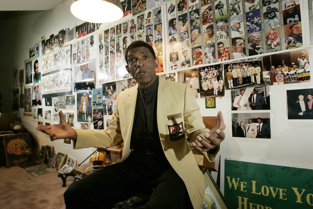 Former NFL player Herb Adderley sits in a room full of memorabilia of his playing days with the Green Bay Packers, at his home in Mantua, N.J., Oct. 2, 2008. A federal jury has ordered the NFL Players Association to pay $7.1 million to retired players after finding the union failed to properly market their images. The jury also says the players association should pay an additional punitive damages award and began deliberating on that issue Monday. The class action lawsuit represents 2,056 retirees, including Adderley, who contend the union cut them out of lucrative licensing deals. (AP Photo/Mel Evans)
