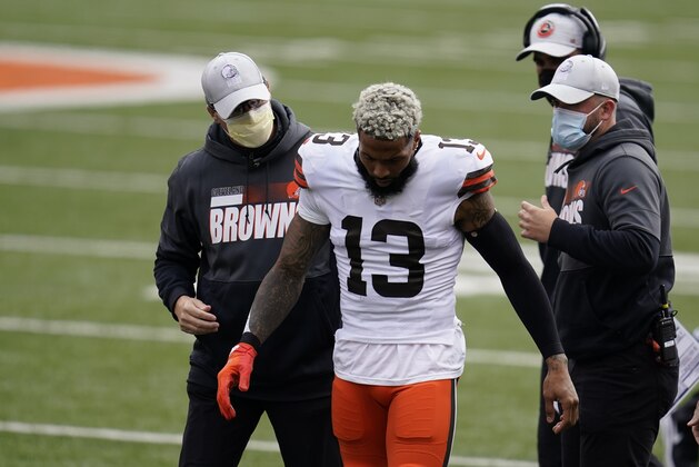 Cleveland Browns' Odell Beckham Jr. (13) leaves the field after being injured during the first half of an NFL football game against the Cincinnati Bengals, Sunday, Oct. 25, 2020, in Cincinnati. Browns star wide receiver Odell Beckham Jr. will miss the rest of the season after tearing a knee ligament during Sunday's 37-34 win at Cincinnati. (AP Photo/Michael Conroy) Cleveland Browns' Odell Beckham Jr. (13) leaves the field after being injured during the first half of an NFL football game against the Cincinnati Bengals, Sunday, Oct. 25, 2020, in Cincinnati. Browns star wide receiver Odell Beckham Jr. will miss the rest of the season after tearing a knee ligament during Sunday's 37-34 win at Cincinnati. (AP Photo/Michael Conroy)