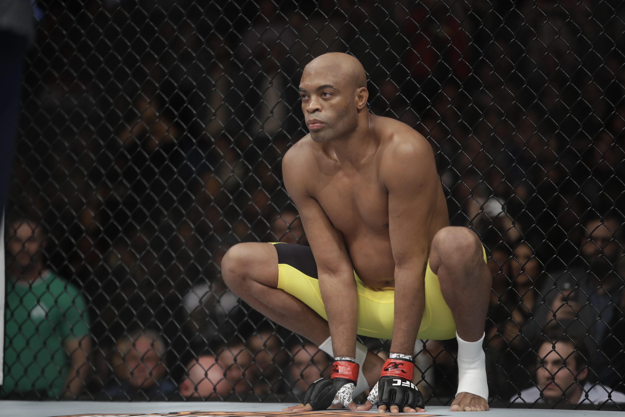 Anderson Silva, of Brazil, squats before a middleweight  mixed martial arts bout against Derek Brunson at UFC 208 Saturday, Feb. 11, 2017, in New York.  Silva won the fight. (AP Photo/Frank Franklin II)