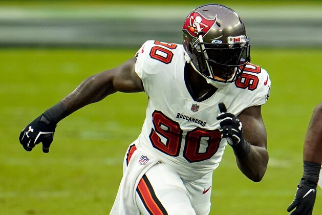 Tampa Bay Buccaneers outside linebacker Jason Pierre-Paul (90) rushes the line of the Las Vegas Raiders during the first half of an NFL football game, Sunday, Oct. 25, 2020, in Las Vegas. (AP Photo/Jeff Bottari) Tampa Bay Buccaneers outside linebacker Jason Pierre-Paul (90) rushes the line of the Las Vegas Raiders during the first half of an NFL football game, Sunday, Oct. 25, 2020, in Las Vegas. (AP Photo/Jeff Bottari)