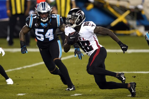 Atlanta Falcons wide receiver Calvin Ridley (18) runs while Carolina Panthers outside linebacker Shaq Thompson (54) chases during an NFL football game in Charlotte, N.C., Thursday, Oct. 29, 2020. (AP Photo/Gerry Broome)