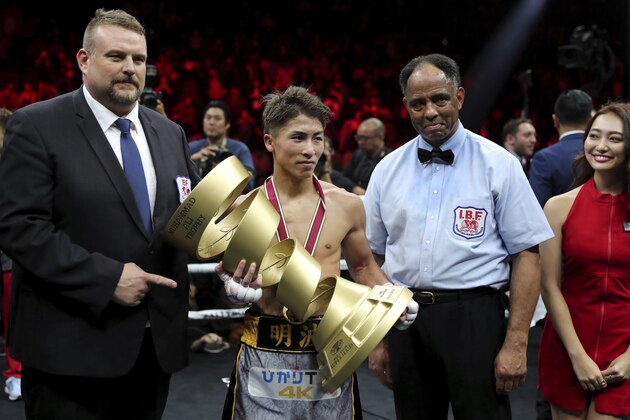 Japan's Naoya Inoue holds the Muhammad Ali Trophy after winning the World Boxing Super Series bantamweight final match in Saitama, Japan, Thursday, Nov. 7, 2019. Inoue beat Philippines' Nonito Donaire with a unanimous decision to win the championship. (AP Photo/Toru Takahashi)