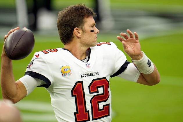 Tampa Bay Buccaneers quarterback Tom Brady (12) throws a pass during warmups prior to facing the Las Vegas Raiders during the first half of an NFL football game, Sunday, Oct. 25, 2020, in Las Vegas. (AP Photo/Jeff Bottari)