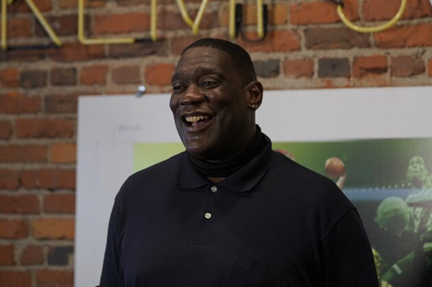 Shawn Kemp, a former NBA basketball player for the Seattle SuperSonics and several other teams, reacts as he talks to reporters about the grand opening of Shawn Kemp's Cannabis, the marijuana dispensary he owns with several business partners, Friday, Oct. 30, 2020, in downtown Seattle. (AP Photo/Ted S. Warren)