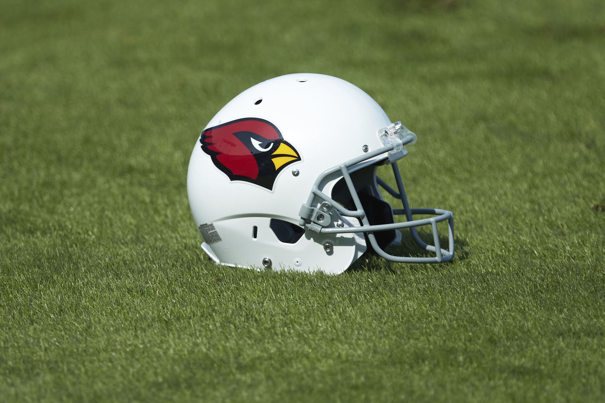 An Arizona Cardinals helmet sits on the turf at Bank of America Stadium prior to an NFL football game against the Carolina Panthers, Sunday, Oct. 4, 2020, in Charlotte, N.C. (AP Photo/Brian Westerholt)