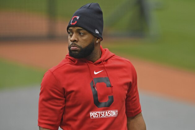 Cleveland Indians' Carlos Santana exits the batting cage before Game 1 of an American League wild-card baseball series against the New York Yankees, Tuesday, Sept. 29, 2020, in Cleveland. (AP Photo/David Dermer)