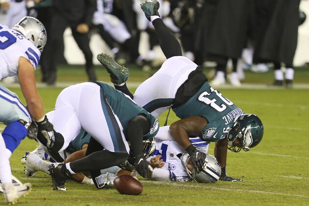 Philadelphia Eagles' Javon Hargrave (93) and T.J. Edwards (57) sack Dallas Cowboys quarterback Ben DiNucci (7) and force a fumble that was recovered by Rodney McLeod (23) who ran 53 yards for a touchdown during the fourth quarter of an NFL football game, Sunday, Nov. 1, 2020, in Philadelphia. The Eagles defeated the Cowboys 23-9. (AP Photo/Rich Schultz)