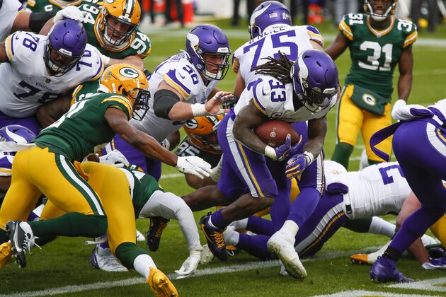 Minnesota Vikings' Dalvin Cook runs for a touchdown during the first half of an NFL football game against the Green Bay Packers Sunday, Nov. 1, 2020, in Green Bay, Wis. (AP Photo/Matt Ludtke)